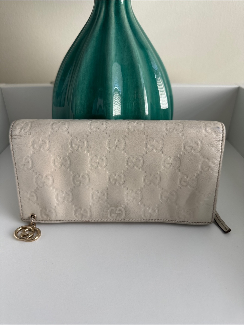 Gucci Ivory Embossed GG Continental Wallet with Gold Charm